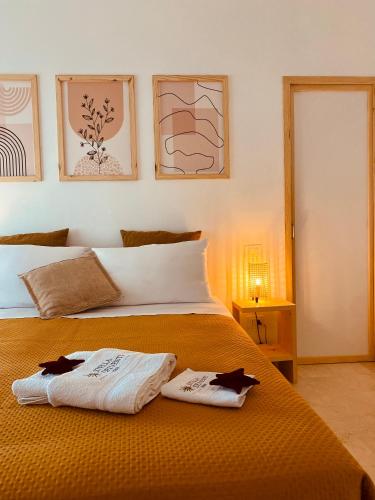 a bedroom with a bed with two towels on it at Stella dei Venti B&B in San Salvo