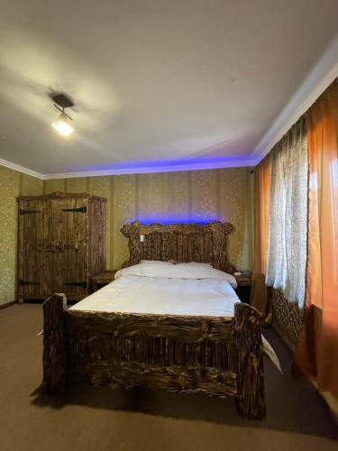 a bedroom with a large bed in a room at GT Hotel in Chernivtsi