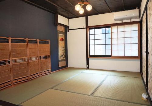 a room with a room with lockers and a window at Kyoto Villa Fuka in Kyoto