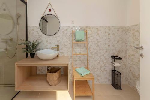 a bathroom with a sink and a mirror at House Pr'Španc in Ljubljana