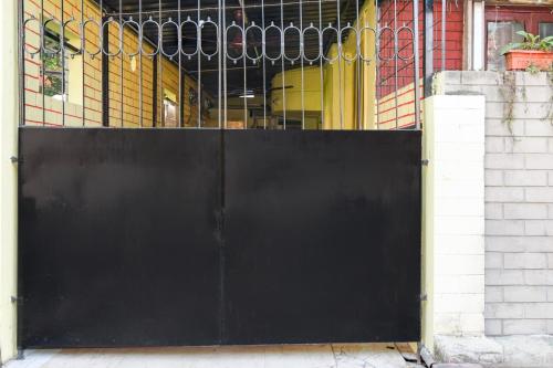 a black gate in front of a building at Super Hotel O Three Sixty Five Inn Guest House in Salt Lake City