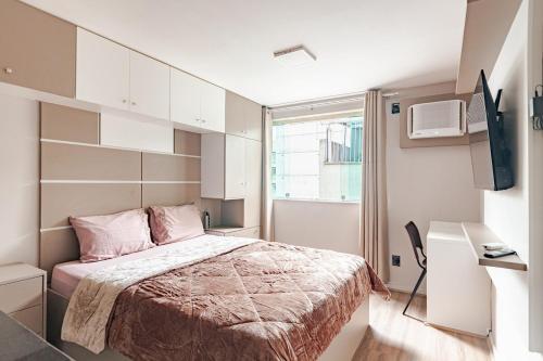 Giường trong phòng chung tại Apartamento no centro de Nova Friburgo