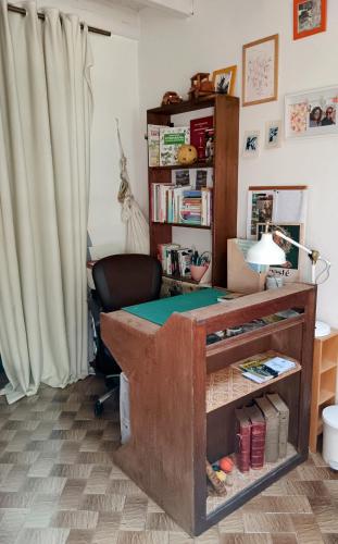a room with a desk with a table with a poker at B&B à la Campagne in Puynormand