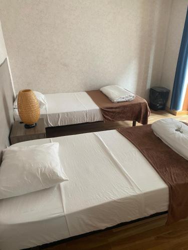 two beds in a room with at 7Lisbon Downtown Private Bedroom With Balcony in Lisbon