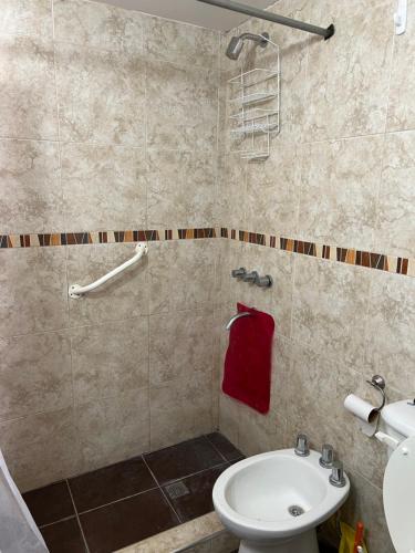 a bathroom with a white toilet and a sink at Espectacular Chalet para 5 personas in Miramar