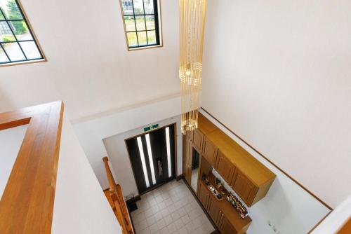 an overhead view of a staircase in a house at Maeda Reaf Resotプライベートビーチまで徒歩3分 in Onna