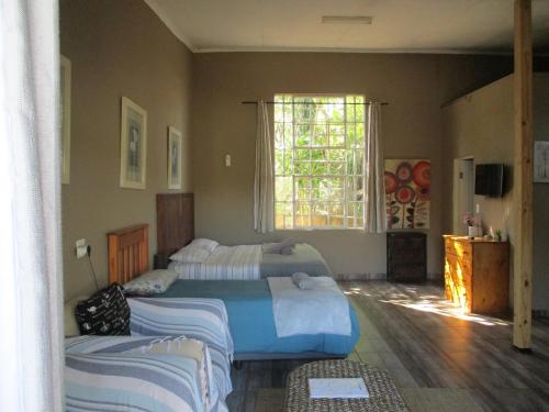 Cama o camas de una habitación en Leopard Tree Retreat