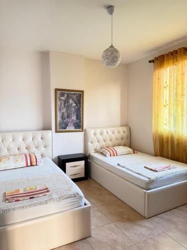 Кровать или кровати в номере Apartments Il Fiore