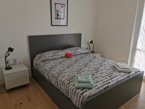 a bedroom with a bed with a red heart on it at Cuore Rosso in Chiavari