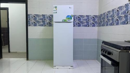 Dapur atau dapur kecil di شقة النخيل المخدومة - Palm Hotel Apartments