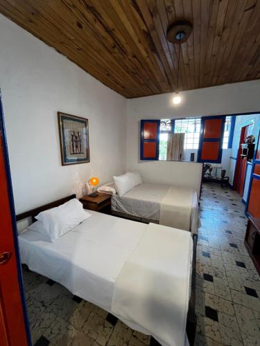 Hotel Hacienda Inglaterraにあるベッド