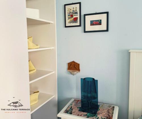 a vase sitting on a shelf in a room at The Vulcano Terrace in Vulcano