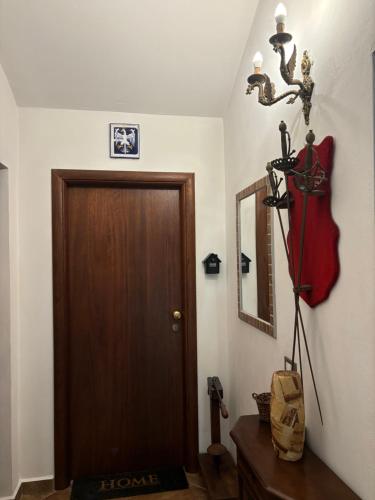 a room with a brown door and a mirror at Agriturismo San Michele in San Michele