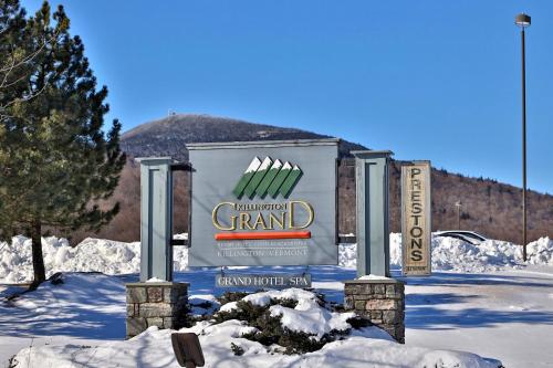 a sign for a grandstand in the snow at Killington Grand Resort Hotel in Killington