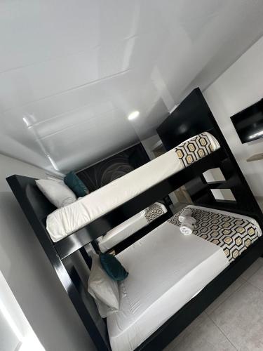 Postel nebo postele na pokoji v ubytování Hotel Millenium Victoria Plaza