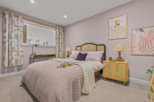 a bedroom with a bed and a window at Luxury 2-Bed with Balcony & Secure Parking in Leeds