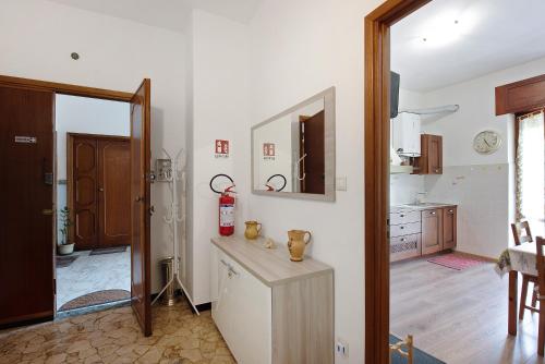 a kitchen with a sink and a fire extinguisher at La Casa Della Gioia - Serravalle in Serravalle Scrivia