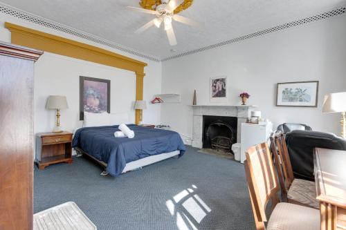 a bedroom with a bed and a fireplace at Comfort Room - Hotel Le Cavalier by M11 in Quebec City
