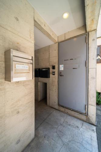 a kitchen with a large refrigerator in a room at 両国駅前 in Tokyo