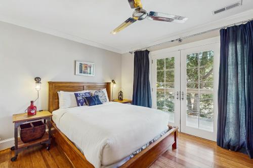 a bedroom with a bed and a window at Lake Therapy in Lake Lure