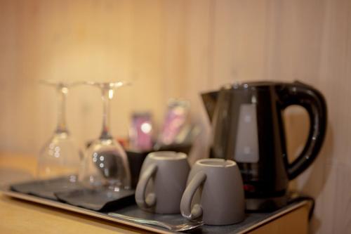 a tray with affeepot and cups on a table at IceHotel in Jukkasjärvi