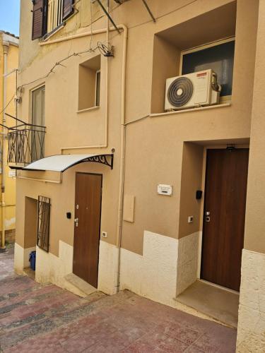 a building with a door and a microwave on the side at Studio Apartments Pirandello 11 in Agrigento