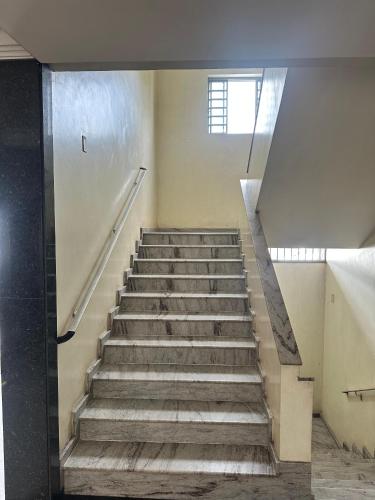 a staircase in a building with a stair case at Panorama Hotel in Belém