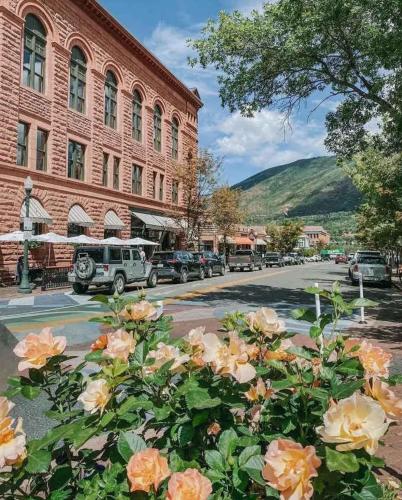 a bunch of flowers in front of a building at New Listing Renovated 2 BR Aspen Condo in Aspen