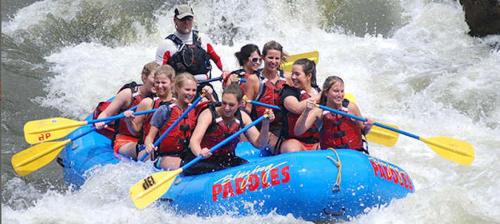 a group of people on a raft in the water at New Listing Renovated 2 BR Aspen Condo in Aspen