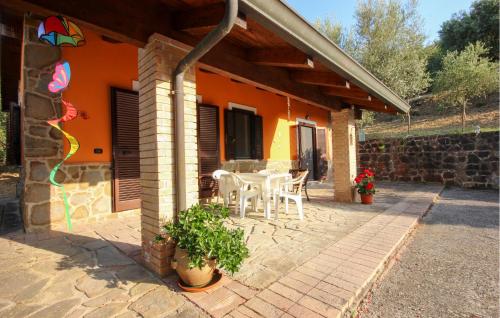 a patio of a house with a table and chairs at Gorgeous Home In Perdifumo in Perdifumo