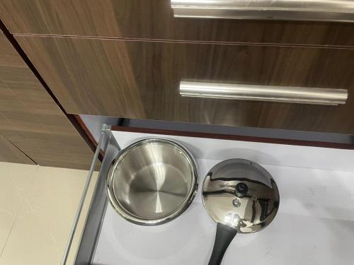 a magnifying glass and a spoon on a counter at Naidu Nivasam in Secunderabad