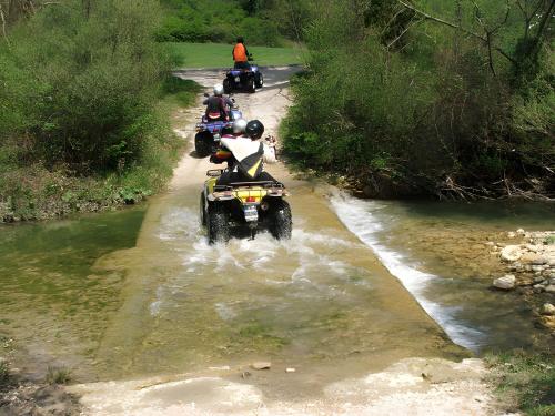 a group of people riding motorcycles in a river at Agriturismo San Domenico-Il Roseto in Radicondoli