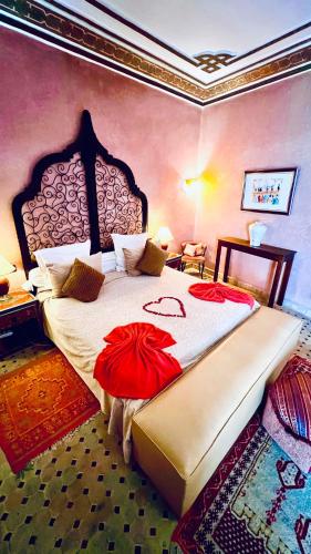 a bedroom with a large bed in a room at Riad Alida in Marrakesh
