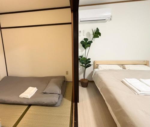 AiES Yotsugi, 8-minute walk from Yotsugi Station, 2 bedrooms, 4 rooms, free parking, direct access to the airport, Tokyo Skytree, Asakusa, Ginza, near shopping malls, parks, and the hometown of Tsubasa Ozora