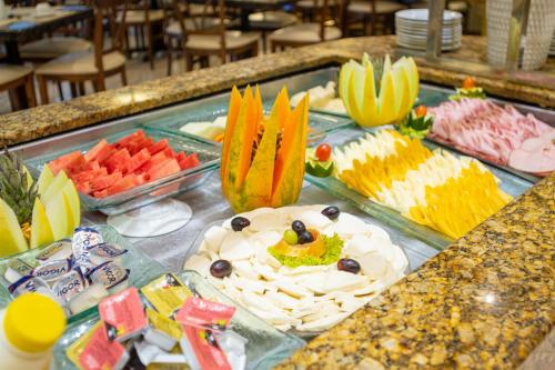 a buffet of different types of food on a table at Portobello Ondina Praia in Salvador