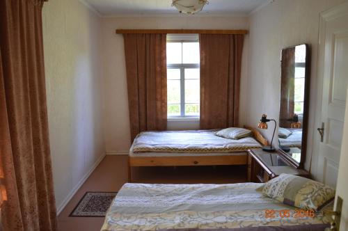 Кровать или кровати в номере Hiirevända Holiday House