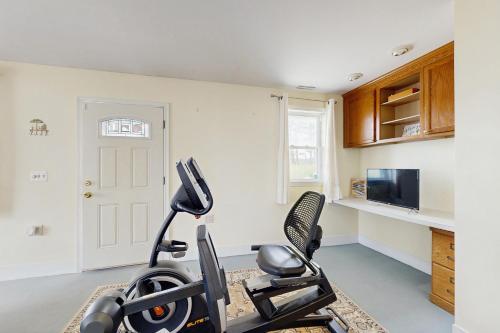 a room with a gym with a treadmill at The Canal House --- 30131 New Castle Rd in Dagsboro
