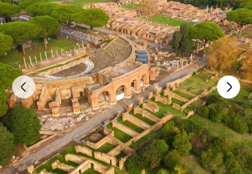 an aerial view of the amphitheatre and the ruins of a building at Attico Sea and Sunset in Lido di Ostia