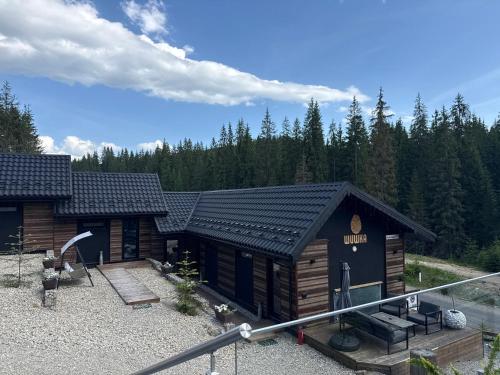 a log cabin in the woods with at Шишка in Bukovel