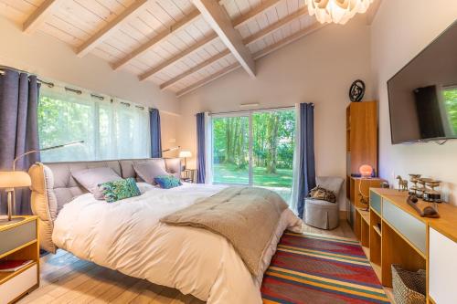 Postel nebo postele na pokoji v ubytování Villa Bosco Vivo - Villa piscine 10 personnes