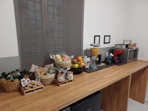 a buffet with fruits and vegetables on a counter at B&B Colle Degli Angeli in Penne