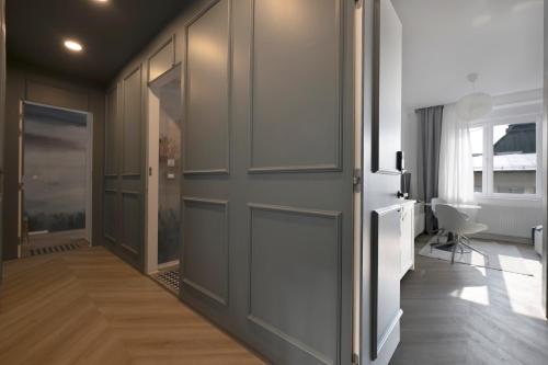 a hallway with a door and a room with a window at Z-One City Center Luxury Apartments in Zagreb