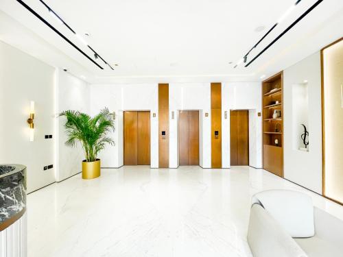a lobby with a plant in the middle at 1bhk brand new in JVC Binghatti Lavender in Dubai