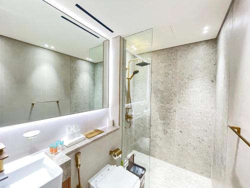 a bathroom with a shower and a sink at 1bhk brand new in JVC Binghatti Lavender in Dubai
