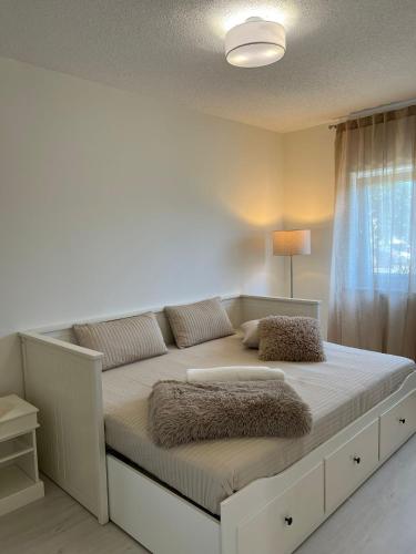 a large bed in a room with a window at Ferienwohnung Hügel Blick in Brücken