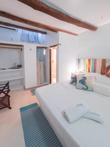 Ένα ή περισσότερα κρεβάτια σε δωμάτιο στο Casa Turquesa