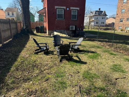 a group of chairs and a table in a yard at City Sanctuary in Cincinnati