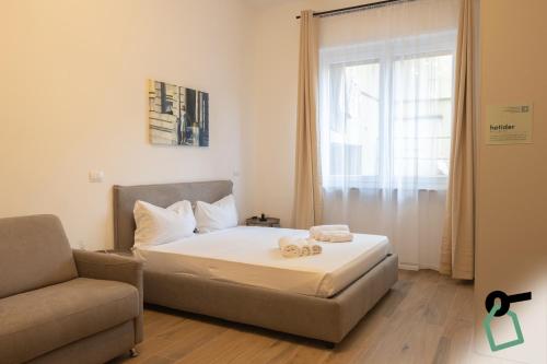 Ένα ή περισσότερα κρεβάτια σε δωμάτιο στο Hotiday Torino OGR
