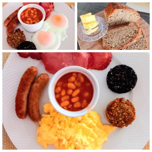 a plate of breakfast food with eggs beans and bread at Grangebeg B&B Dunlavin in Dún Luáin
