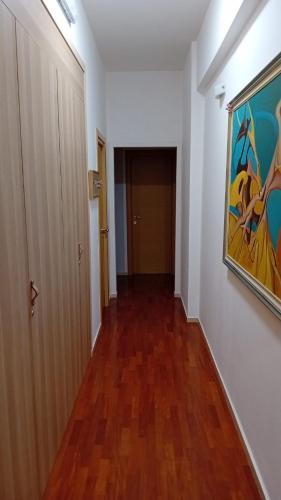 an empty hallway with a painting on the wall at Le Stanze di Nonna Lina in Pagani